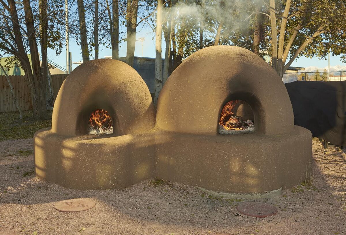 Traditional horno adobe outdoor ovens at the CASA Center of Adams State