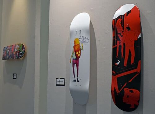 Skateboard deck designs on display - Adams State University