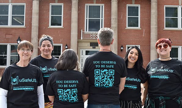 Adams State models uSafeUS branded t-shirts