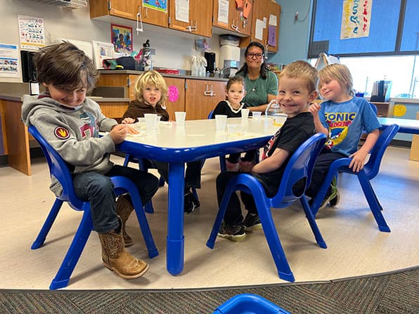 Lisa Lucero and preschool children at Moffat Schools